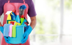 Cleaning Lady holding bucket with cleaning supplies